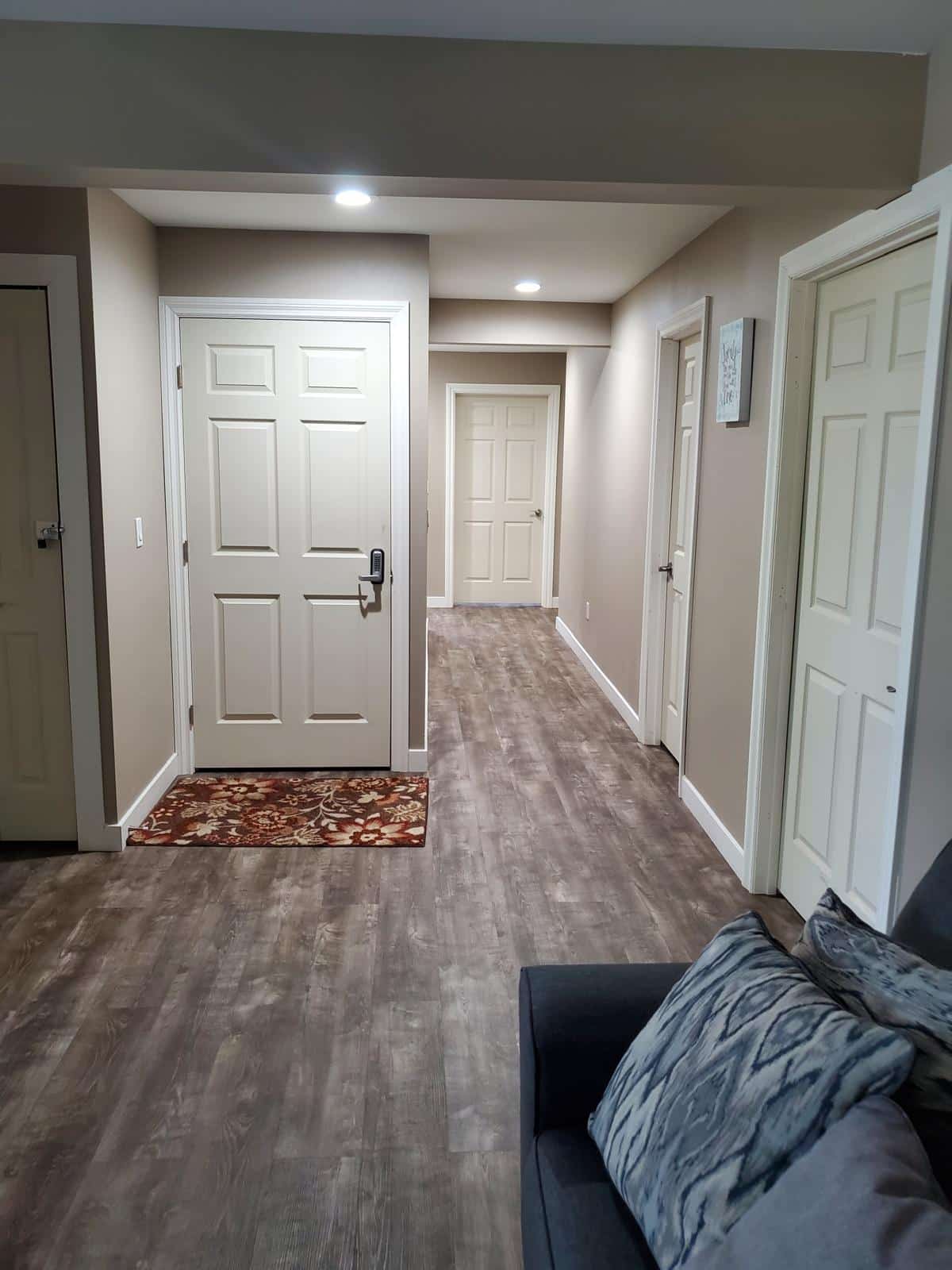 Fully accessible bathroom with grab bars, roll-in shower access, and safety features for senior residents