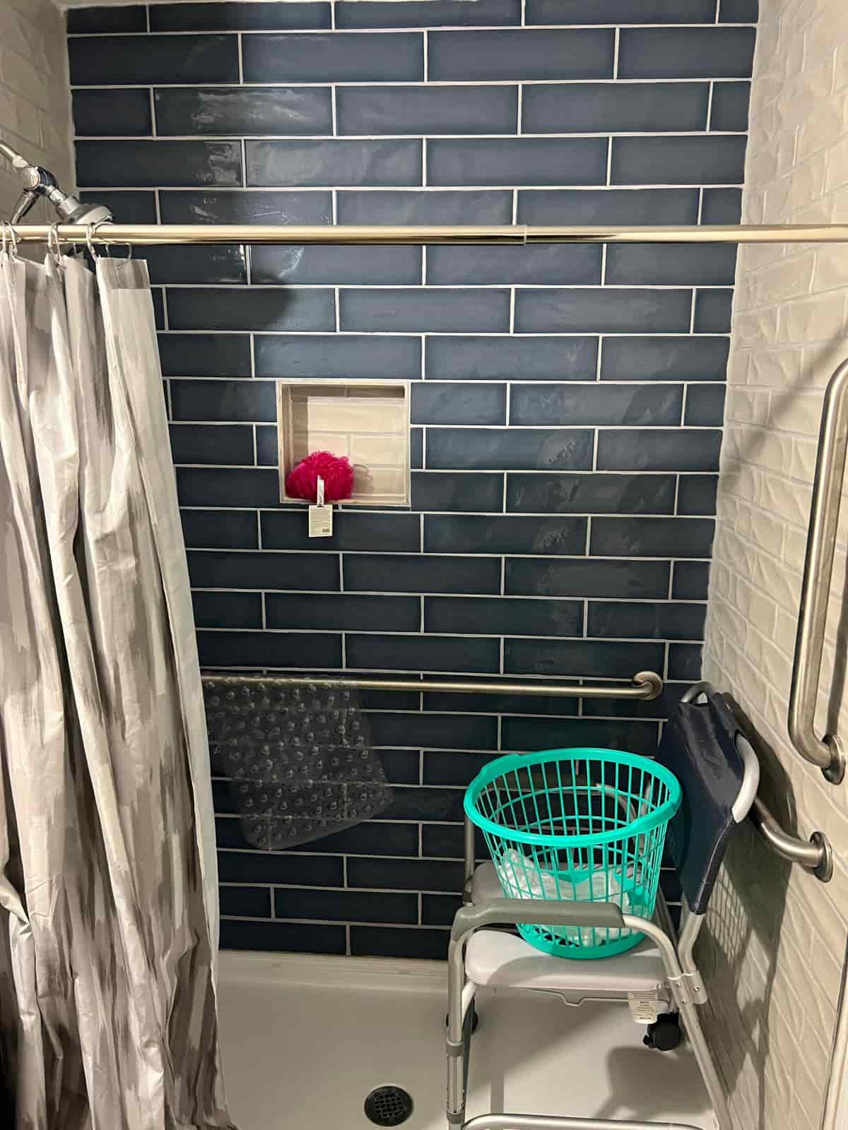 Close-up detail of accessible bathroom fixtures at 1st Blessed AFH, showing grab bars and quality fittings
